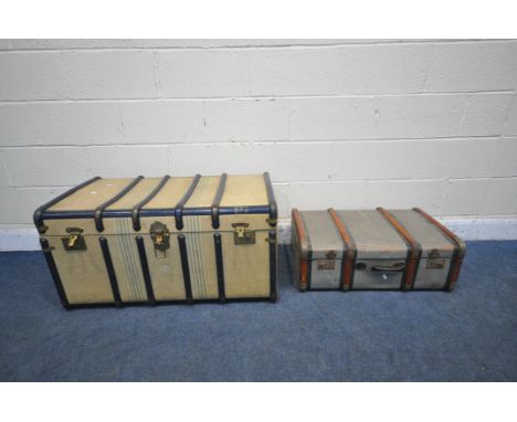 A BEIGE AND DARK BLUE VINTAGE TRAVELLING TRUNK, width 92cm x depth 54cm x height 48cm, along with a vintage suitcase (conditi