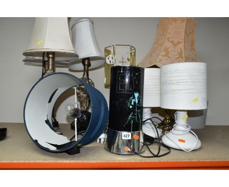 A GROUP OF TABLE LAMPS, comprising three matching silver coloured foliate lamps, a novelty Elvis lamp, two cream ceramic beds