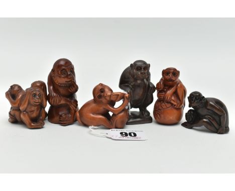 FIVE 20TH CENTURY CARVED TREEN NETSUKE AND AN OKIMONO, all in the form of monkeys with inset eyes, the smallest single monkey