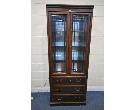 A DREXEL HERITAGE CHIPPENDALE BOOKCASE, the two glazed doors enclosing three adjustable shelves, above three drawers, width 8