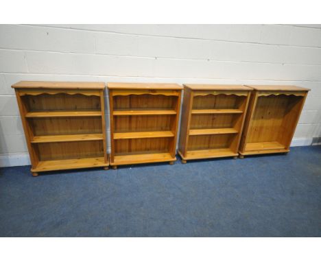 FOUR MATCHING PINE OPEN BOOKCASES, with two adjustable shelves, width 84cm x depth 24cm x height 100cm (condition report: six