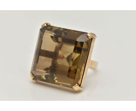 A 9CT GOLD SMOKY QUARTZ RING, designed as a large square smoky quartz within a four claw setting, 9ct hallmark for London 197