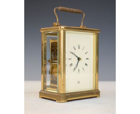 Modern brass cased carriage clock, the off-white dial with Roman numerals and retailers mark for Dent of London   Condition: 