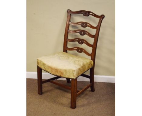 19th Century carved mahogany side chair having a carved and pierced ladder back, stuffed seat and standing on moulded square 