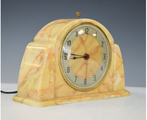 1930's period mottled yellow Bakelite cased mantel clock, the dial with Arabic numerals   Condition: 