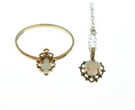 9ct gold ring set opal together with a similar pendant and chain   Condition: 