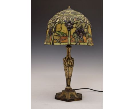 Decorative reproduction table lamp having a stained and leaded glass style shade   Condition: 