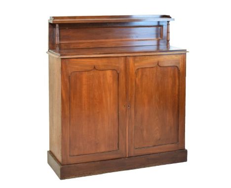 Victorian mahogany chiffonier, the raised back fitted an open shelf supported by turned pillars, the base with two blind pane