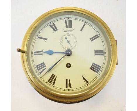 Brass cased ships bulk head clock, the off-white dial with Roman numerals and subsidiary seconds dial   Condition: 