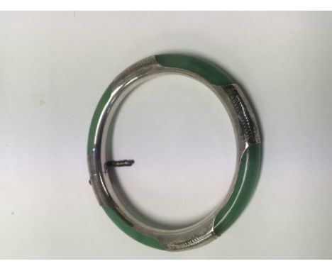 A jade a silver bangle.