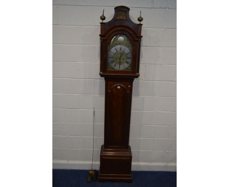 A GEORGE V MAHOGANY EIGHT DAY LONGCASE CLOCK, the slopped hood with a brass panel between a pair of cylindrical finials, a pa