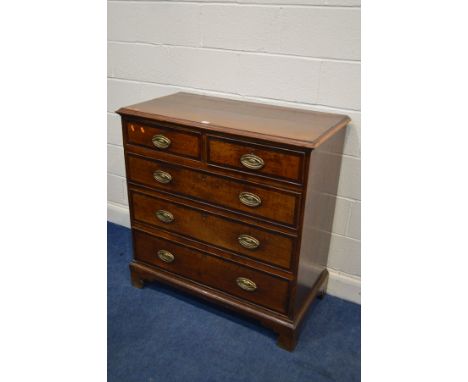 A GEORGIAN OAK CHEST OF TWO SHORT OVER THREE LONG, with crossbanding to each drawer front, brass handles and bracket feet wid