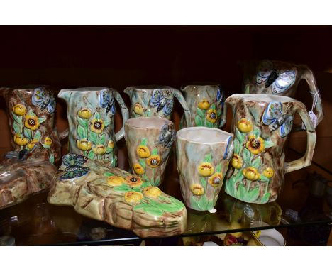 FOURTEEN PIECES OF RADFORD POTTERY BUTTERFLY WARE, comprising eight jugs, tallest height 22cm, two wall pockets, height 23.5c