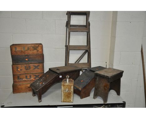 A VINTAGE MAHOGANY SHOE SHINE STOOL, together with another shoe shine stool, an oak stool, a wooden frame step ladder name st