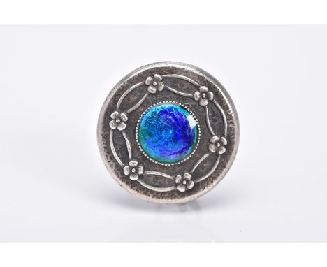AN EARLY 20TH CENTURY CHARLES HORNER BROOCH, the guilloche enamel brooch, of circular form, set with a central panel of blue 