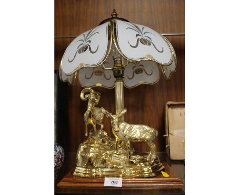 A TABLE LAMP WITH CAST BRASS MOUNTAIN GOAT BASE ON PLINTH 