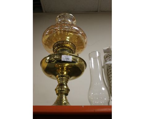 A VINTAGE OIL LAMP WITH SHADE 