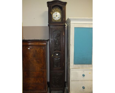 A HEAVILY CARVED CONTINENTAL OAK LONGCASE CLOCK IN THE 18TH CENTURY STYLE, PAINTED DIAL, H 240 CM