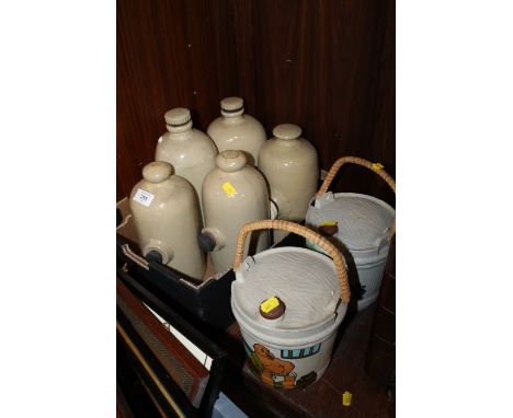 A PAIR OF PAINTED STONEWARE WATER CARRIERS TOGETHER WITH A SELECTION OF VINTAGE HOT WATER BOTTLES 