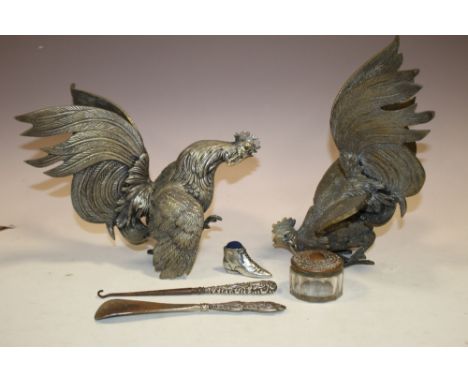 A PAIR OF LARGE BRASS FIGHTING COCKS TOGETHER WITH A SILVER HANDLED BUTTON HOOK AND SHOE HORN, NOVELTY PIN CUSHION ETC