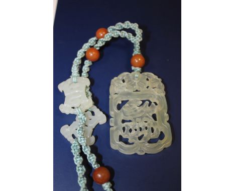 A CARVED JADE NECKLACE 