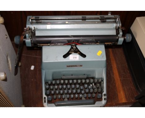 A VINTAGE BLUE IMPERIAL TYPEWRITER 