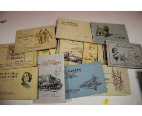 A QUANTITY OF VINTAGE CIGARETTE CARDS INCLUDING NAVAL INTEREST, CRICKETERS, RAILWAY ENGINES, MOTOR CARS ETC (APPROX 15)