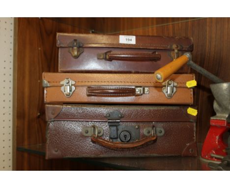 THREE VINTAGE LEATHER SUITCASES 