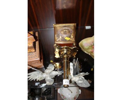 A PAIR OF SMALL SILVER PLATED FIGHTING COCK ORNAMENTS TOGETHER WITH AN UNUSUAL LANTERN CLOCK (3)
