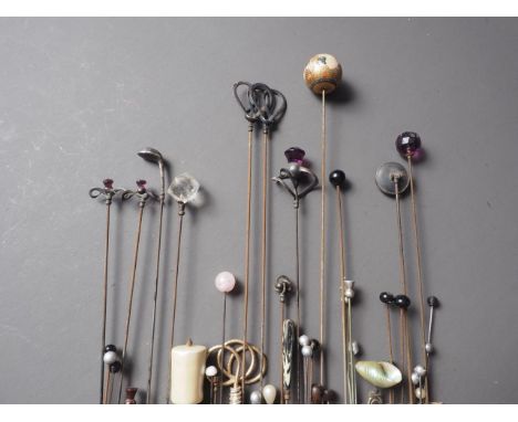 Two pairs of silver topped hat pins, by Charles Horner, two other similar, a hat pin with a Satsuma top, and a number of othe