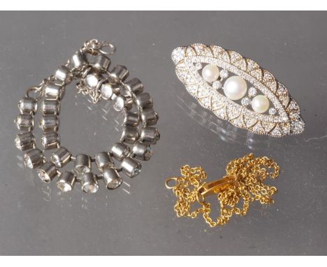 A 9ct gold necklace, 2g, a Chinese silver brooch, and a silver and paste tennis bracelet