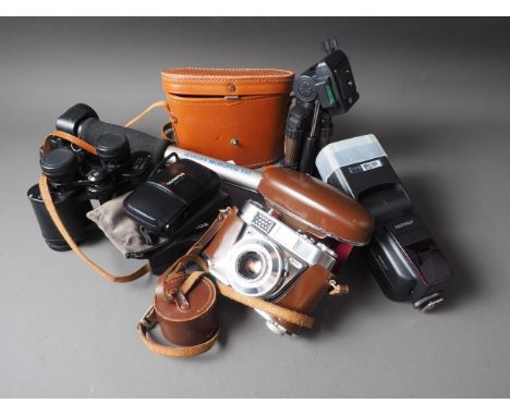 A Minox 35mm camera, a Kodak Retinette with Rodenstock 45mm lens, an Olympus camera and other photographic accessories