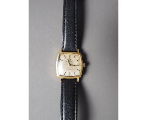 A ladies 18ct gold cased Eterna-Matic wristwatch, with silvered dial and baton numerals, on black leather strap