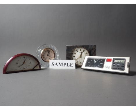Nine quartz movement mantel and alarm clocks, including two Seiko alarm clocks, a Waterford crystal clock etc