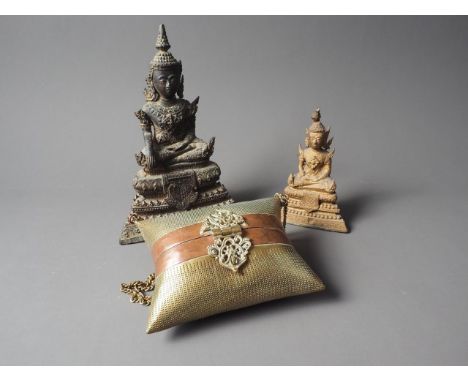A Thai brass and gilt seated buddha, 7" high, a smaller similar, and a brass and copper purse