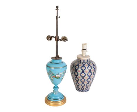 A FAMILLE ROSE STYLE VASE converted to a table lamp, the ovoid body decorated with stylized flowers on a blue and white undul