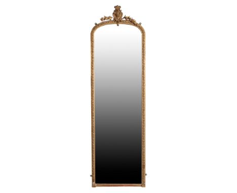 A VICTORIAN GILTWOOD AND COMPOSITION FRAMED PIER MIRROR, circa 1875, the shallow arched top with cartouche cresting flanked b