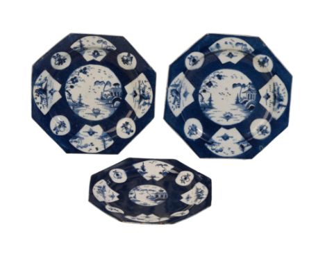 THREE FIRST PERIOD WORCESTER FAN-PANELLED LANDSCAPE DESSERT PLATES, circa 1770-1780, with dark powder blue grounds, pseudo-Ch