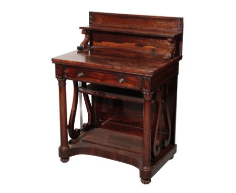 A REGENCY ROSEWOOD SIDE TABLE, early 19th century, with shelf gallery on scroll carved supports above a frieze drawer, on col