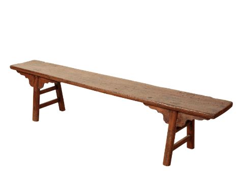 A HARDWOOD AND ELM BENCH 19th/20th century, the single plank top supported by block legs with shaped corner brackets, 45cm hi