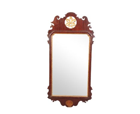 A PARCEL-GILT WALNUT FRAMED WALL MIRROR IN GEORGE I STYLE, 19th century, with openwork foliate cresting and fretworked edges 