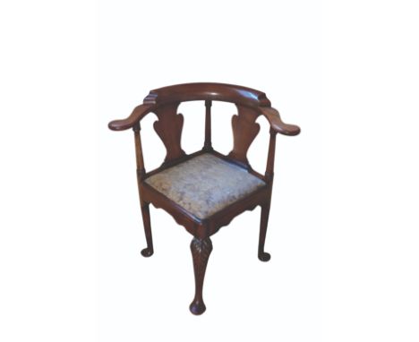 A GEORGE II MAHOGANY CORNER ARMCHAIR with two vase-shaped splats, drop-in seat and front cabriole leg carved with leaves, 75c