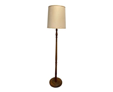 A STANDARD LAMP with a baluster turned column, 188cm high with shade