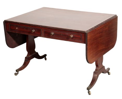 A REGENCY MAHOGANY SOFA TABLE, early 19th century, the rectangular top cleated at each side for the drop leaves, with twin fr