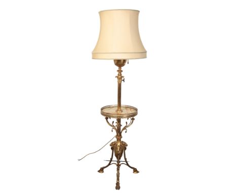 A GILT METAL AND ONYX STANDARD LAMP the urn finial above a Corinthian capital and columnar stem, finishing at a tripod base w