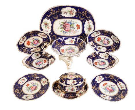 A BLOOR DERBY PART DINNER SERVICE decorated with floral sprays within a blue and gilt border, the set comprising plates, serv