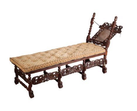 A WILLIAM AND MARY OAK DAYBED part late 17th century with later elements, with rectangular cane seat and squab cushion covere