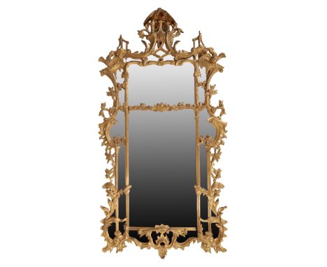 A LARGE GILTWOOD WALL MIRROR IN THE MANNER OF THOMAS CHIPPENDALE of recent manufacture, with an openwork foliate cresting fla