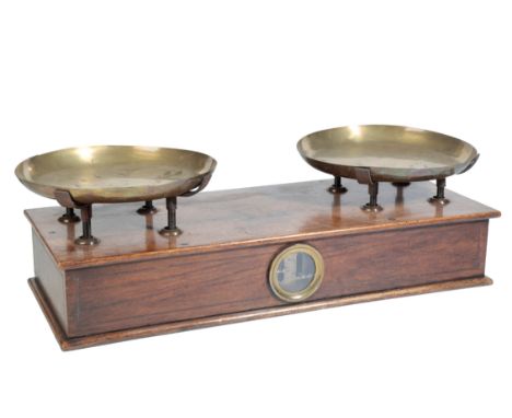 ROBERT A VIENNE VINTAGE SCALES the scales set in an oak case, measuring 64cm wide and 26cm deep