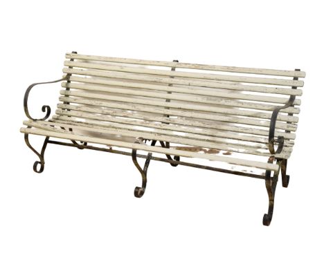 A WROUGHT IRON AND PAINTED WOOD GARDEN BENCH with scrolling arms and legs, 80cm high x 180cm wide x 76cm deep
